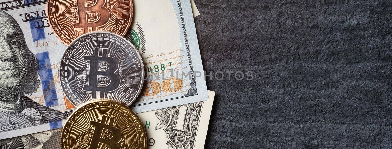 Business top view design concept of cryptocurrency bitcoin with USD Dollar paper currency money over dark black table background.