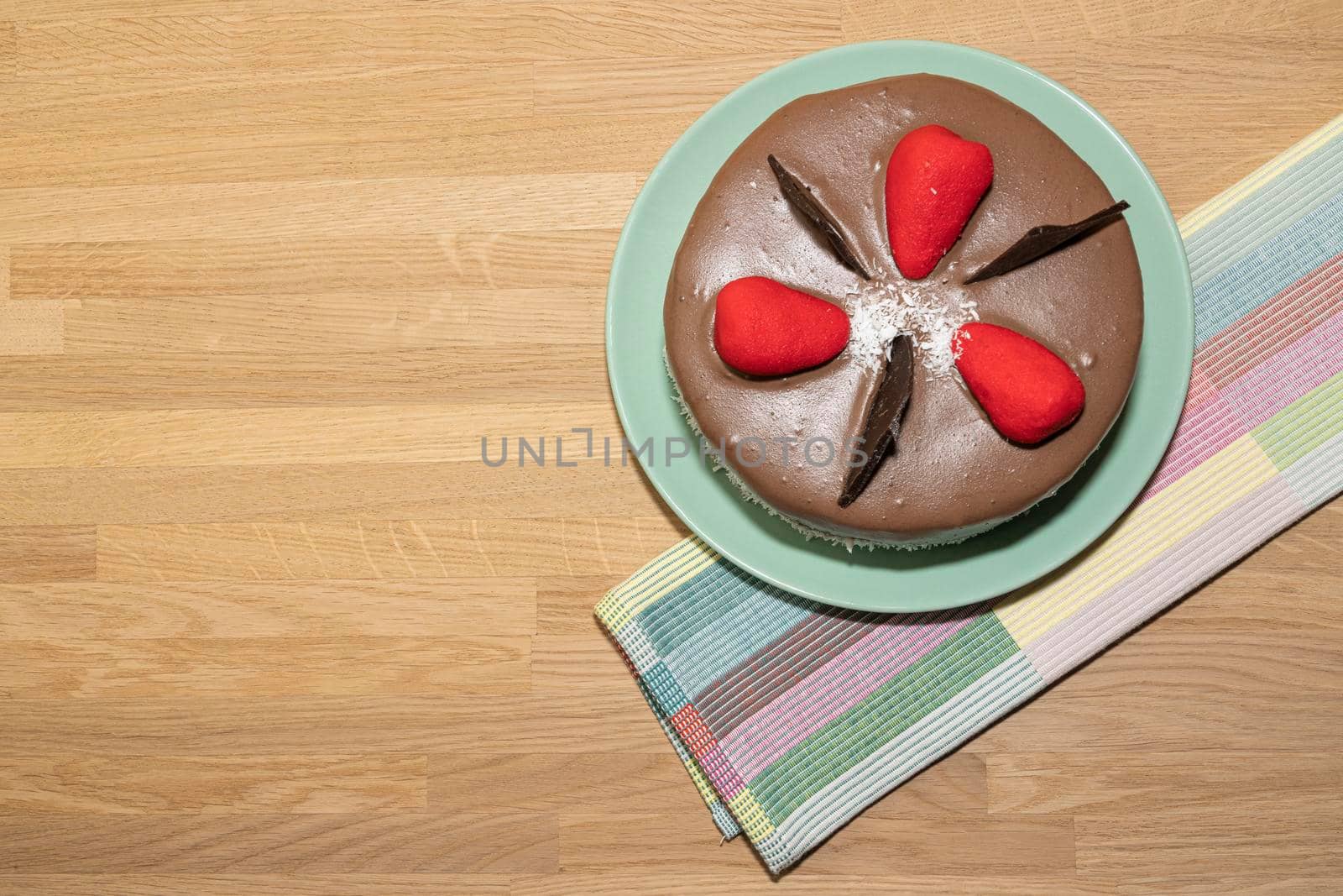 chocolate cake and towel on wooden background. High quality photo