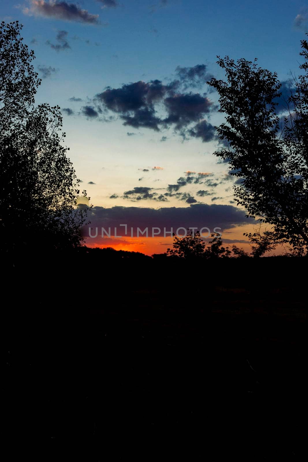 Backlit sunset with yellow, red and blue colors in southern Andalusia, Spain