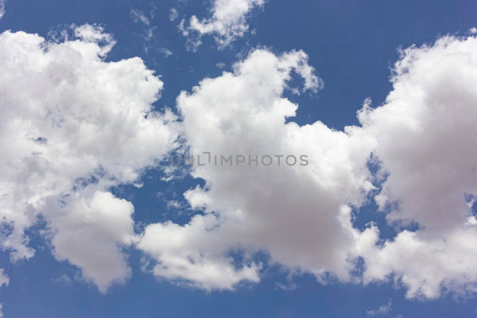 Blue sky full of fluffy clouds in southern of Spain by loopneo