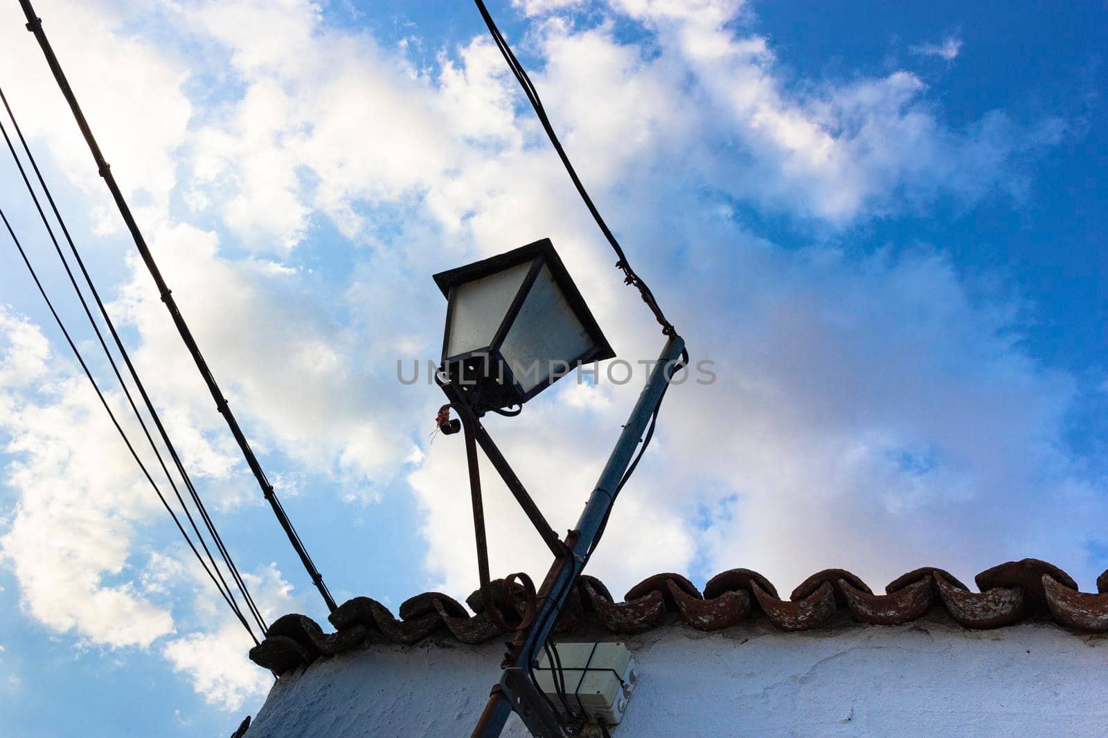 Lantern on a wall of a village in Andalusia southern Spain