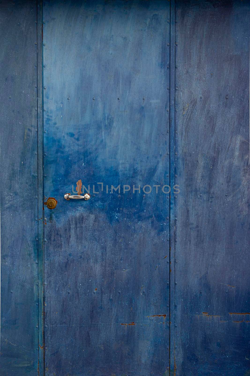 Metal of a metal door, weathered in southern Spain by loopneo
