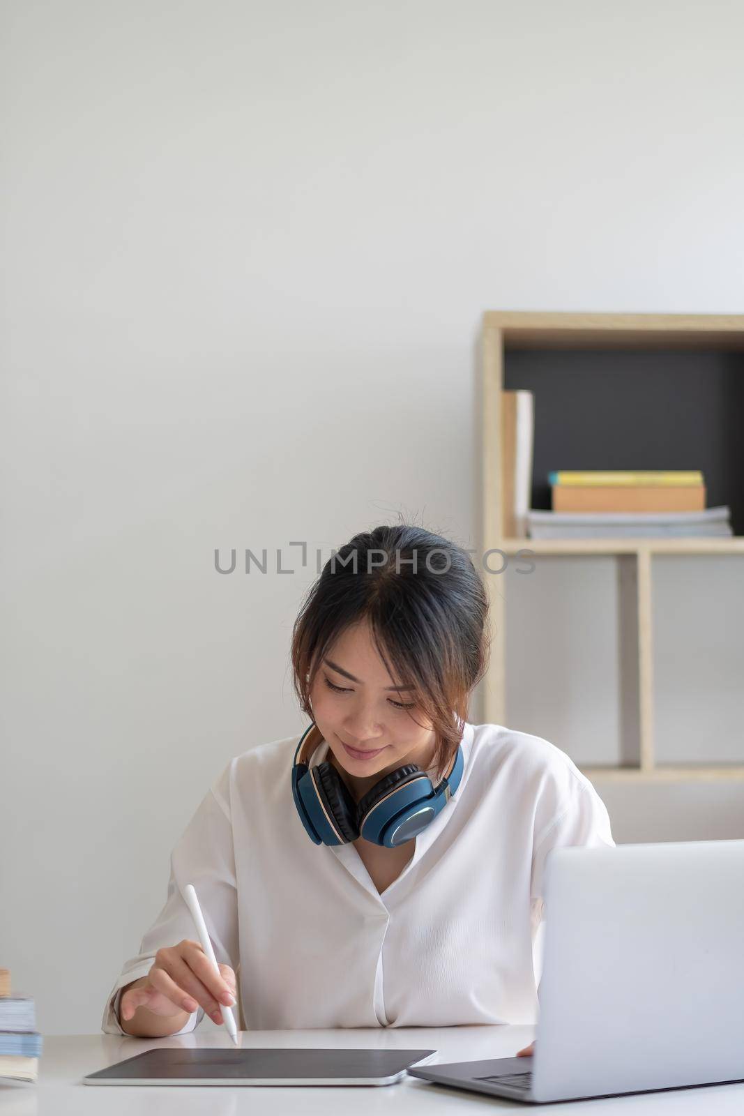 Young asian woman student study at home using laptop and learning online by nateemee