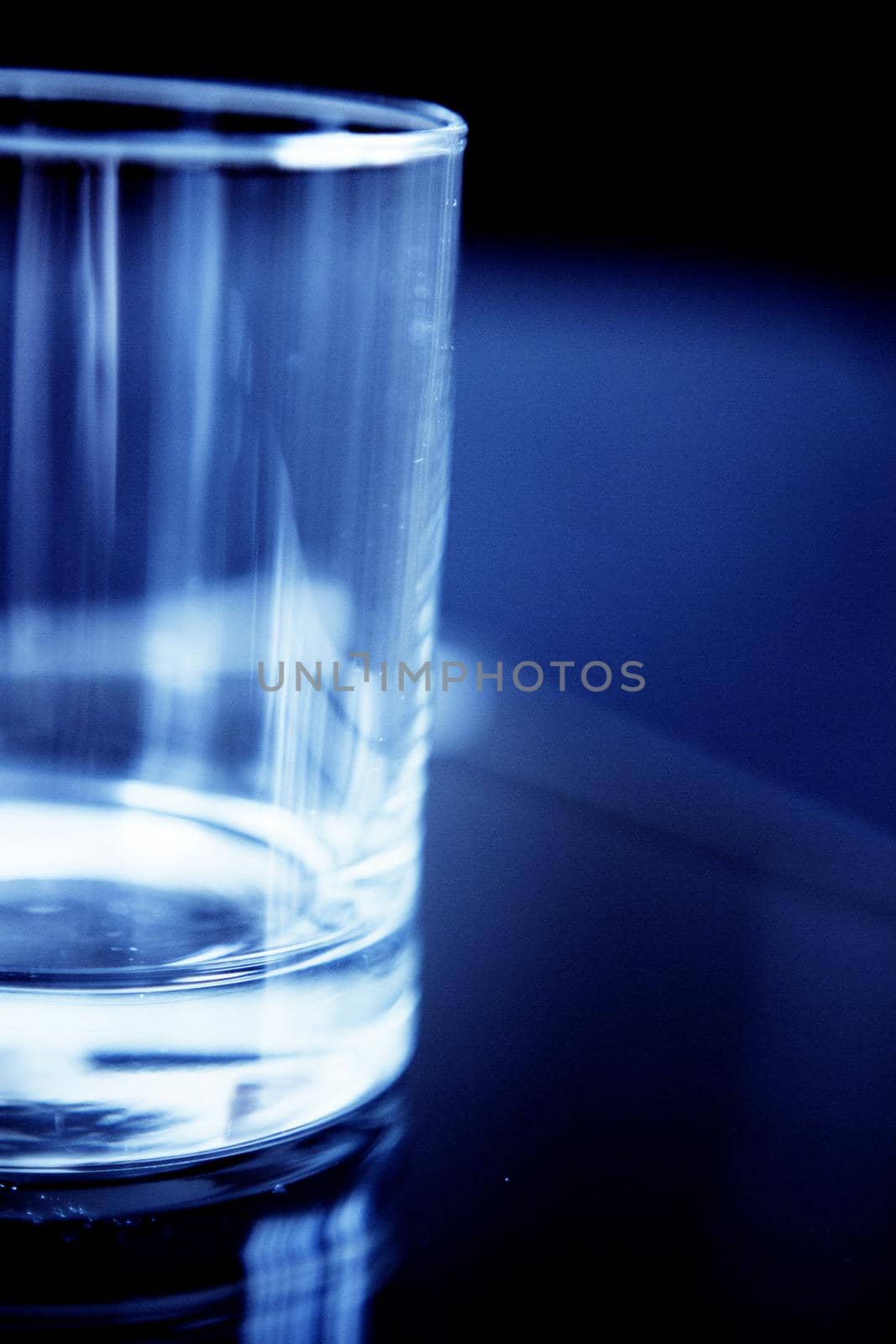 Empty glass transparent glass on dark background. Copy space