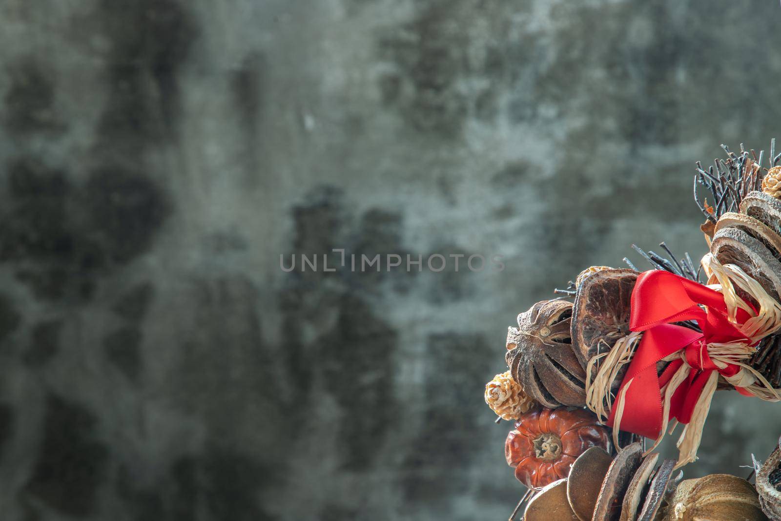 Different Dry fruits on old cement wall background. Copy space, Selective focus.