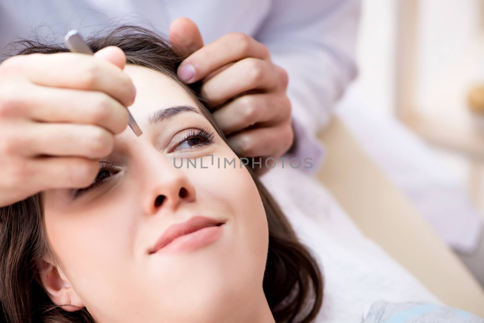 Woman visiting doctor cosmetologyst in beauty concept