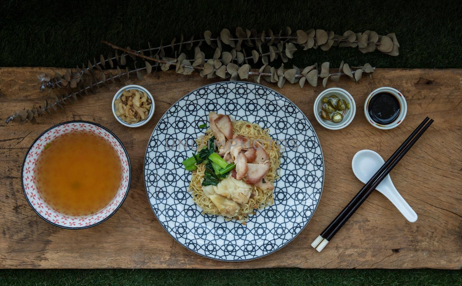 Egg Noodle with Roasted Pork and Wonton Served with Clear Soup. Cantonese chinese food, Selective focus.