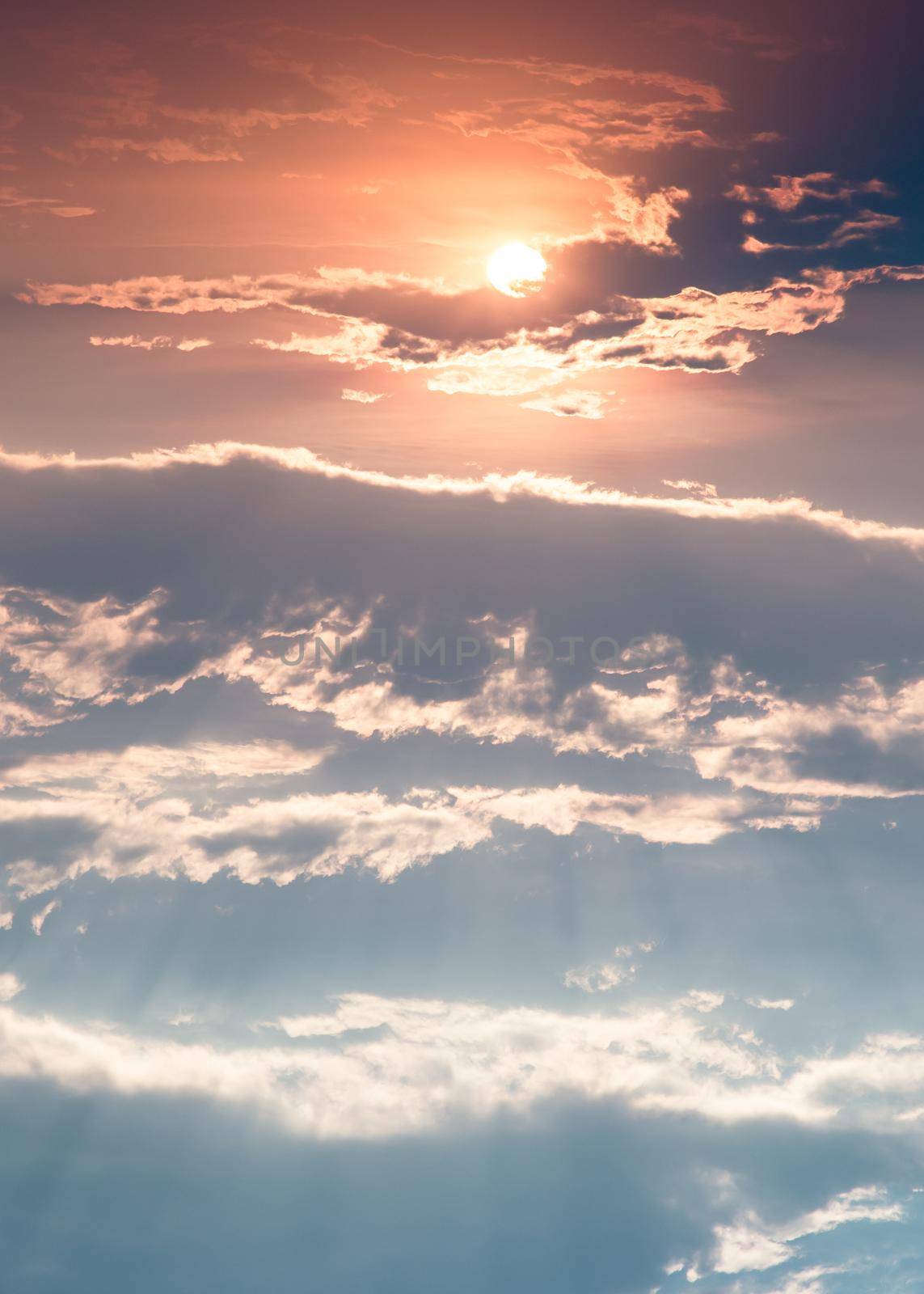 Beautiful sunset sky above clouds with dramatic light. Beautiful blazing sunset landscape, Horizon. Warm Colours, copy space, No focus, specifically.