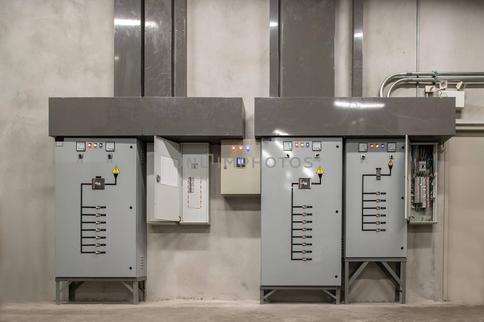 Electric voltage control room cabinets of condominium. Selective focus.