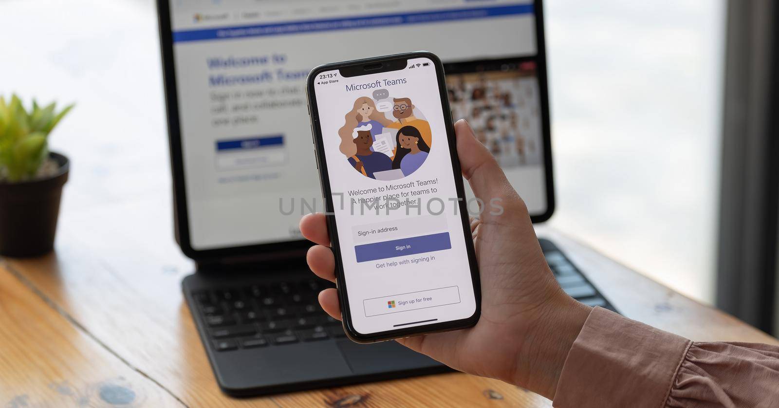 CHIANG MAI, THAILAND - MAR 21, 2021 : A working from home employee is downloading the Microsoft Teams social platform, ready for remote working in isolation from home. by nateemee