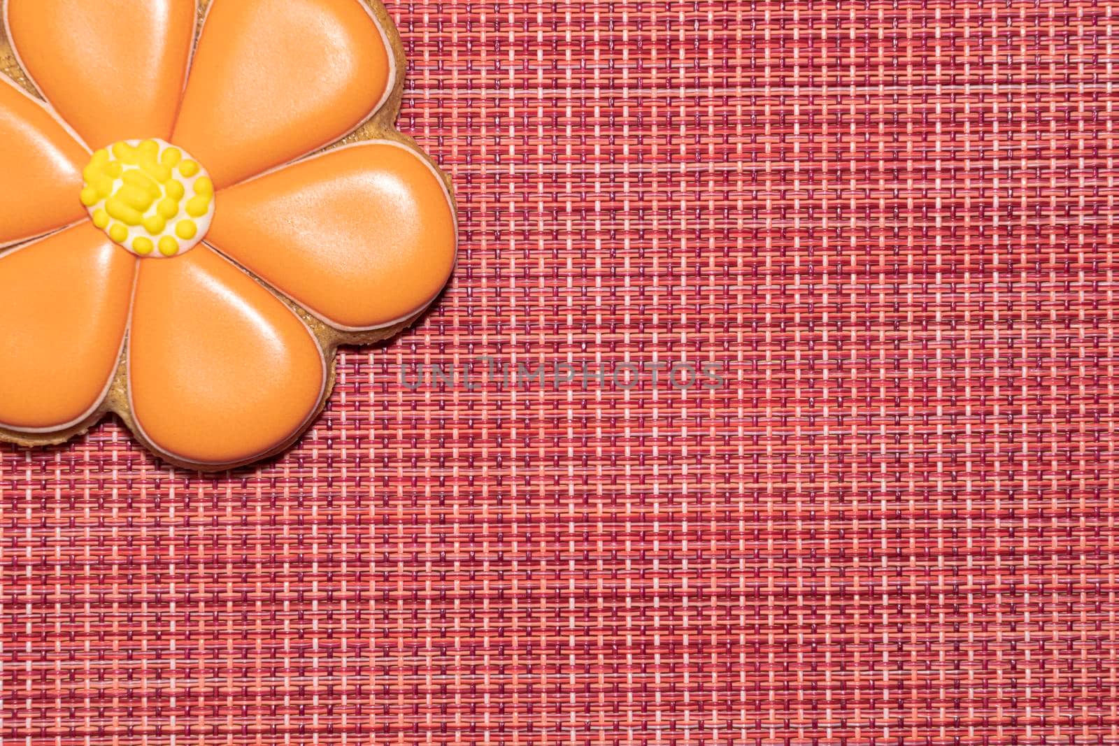 ginger cookies in the form of a flower on a red background. High quality photo