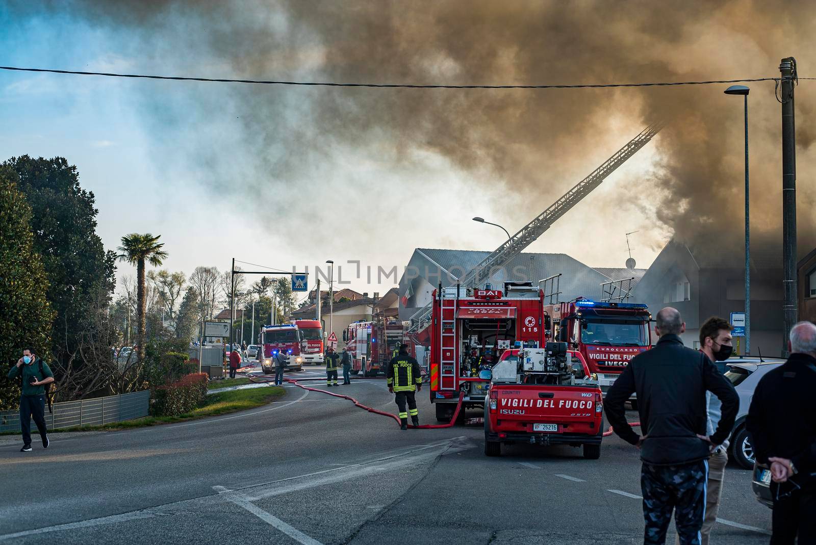 VILLANOVA DEL GHEBBO, ITALY 23 MARCH 2021: Fire house firefighters smoke