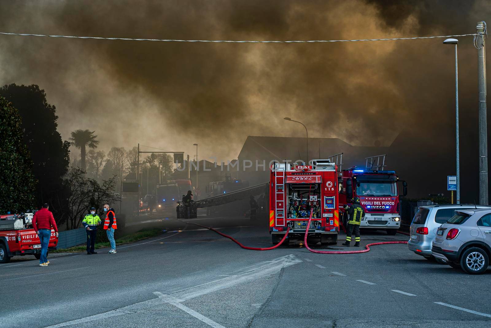 VILLANOVA DEL GHEBBO, ITALY 23 MARCH 2021: Fire house firefighters and smoke