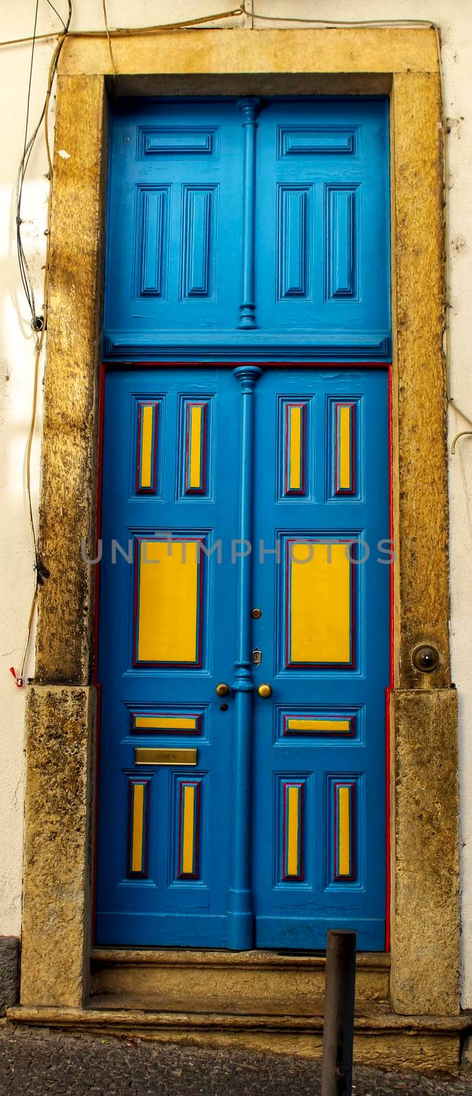 Old colorful wooden door in Lisbon, Portugal