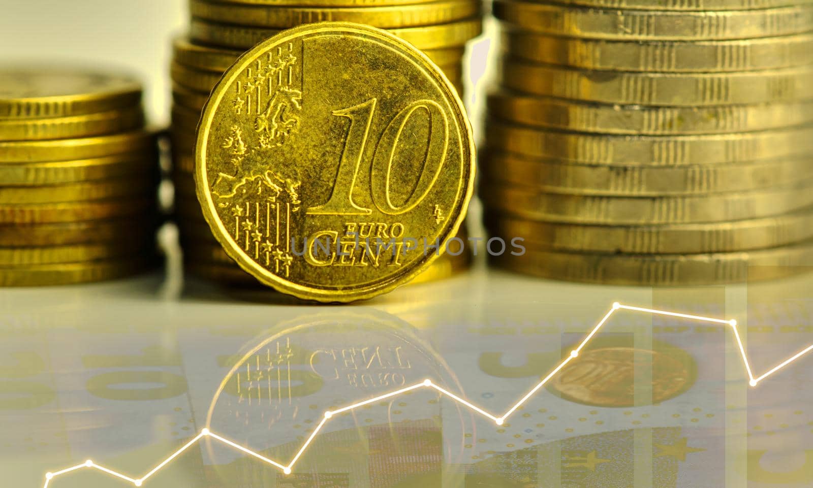 A close-up of 10 cent coins and other coins stacked up. Show the concept of flourishing investment and financial valuation.