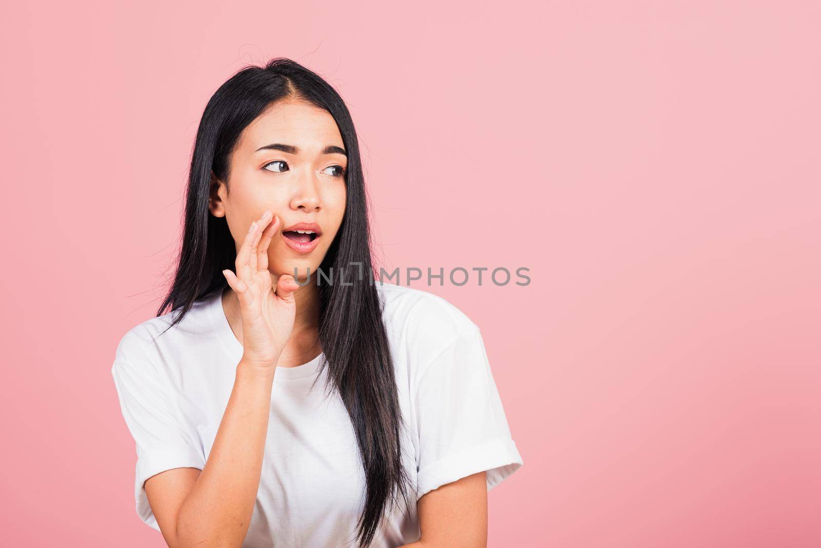 woman teen standing hand on mouth talking whisper secret rumor by Sorapop