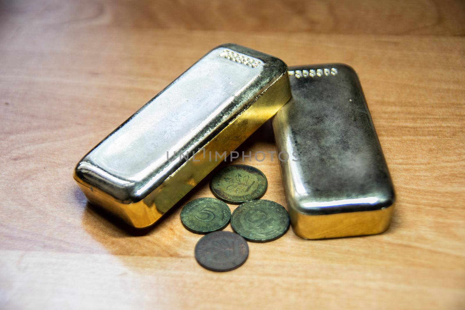 valuable gold bars and worthless small coins