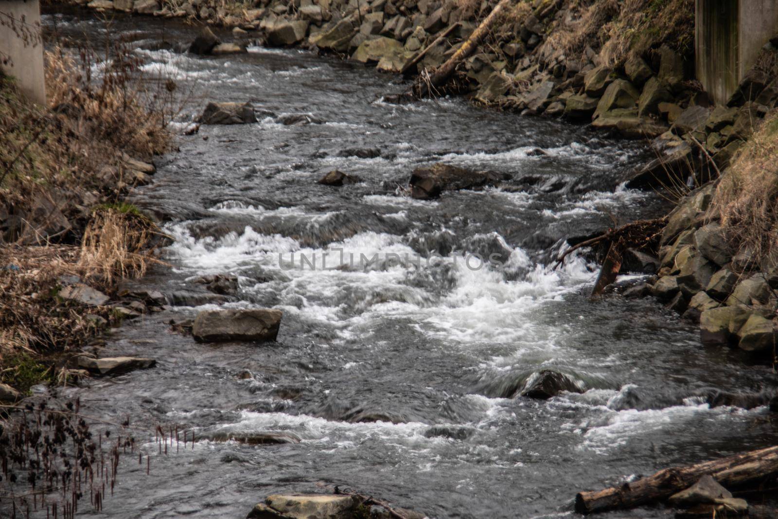 wild river in spring with spray