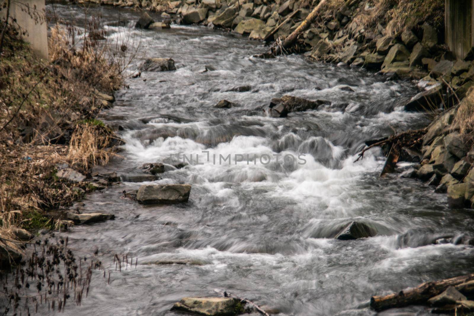 wild river in spring with spray