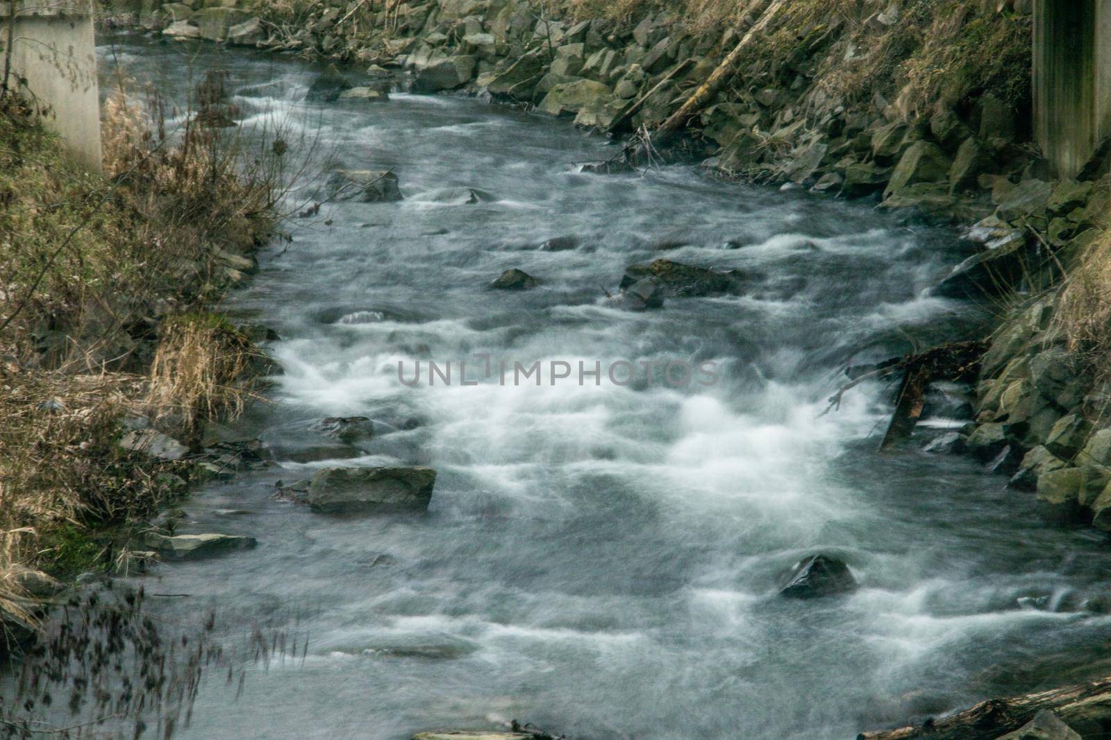 wild river in spring with spray