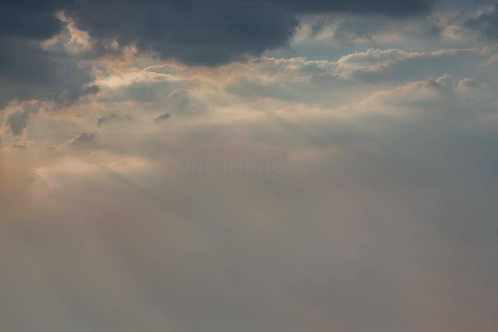 The cloudy beautiful sky with the light shining from the sun. The softness of the cloud creates a feeling of relaxation. copy space. No focus, specifically.