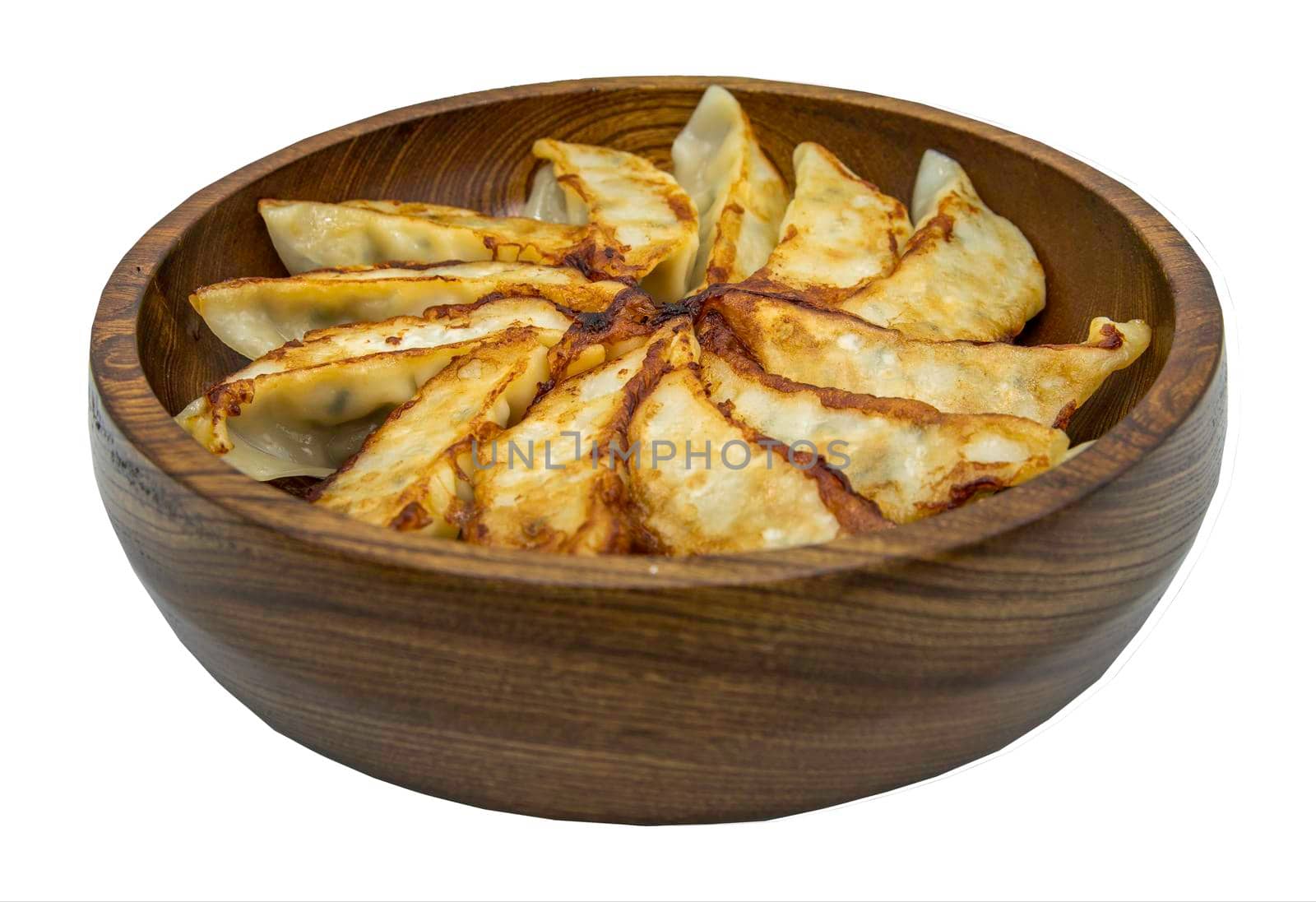 Asian dinner : Fried japanese gyoza dumplings on wooden bowl isolated on white background with clipping path. Selective focus.