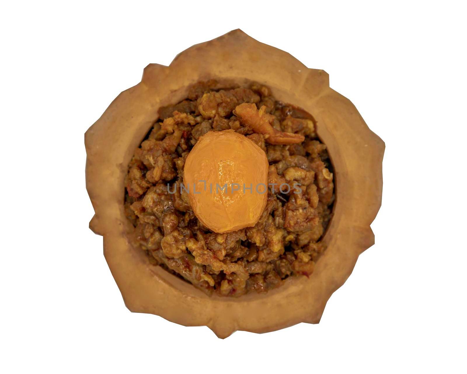 Thai style food : Stir-Fried Pork Crackle with Curry Paste (Fried ginger pork with salted duck egg) isolated on white background with clipping path. Top view, Selective focus.
