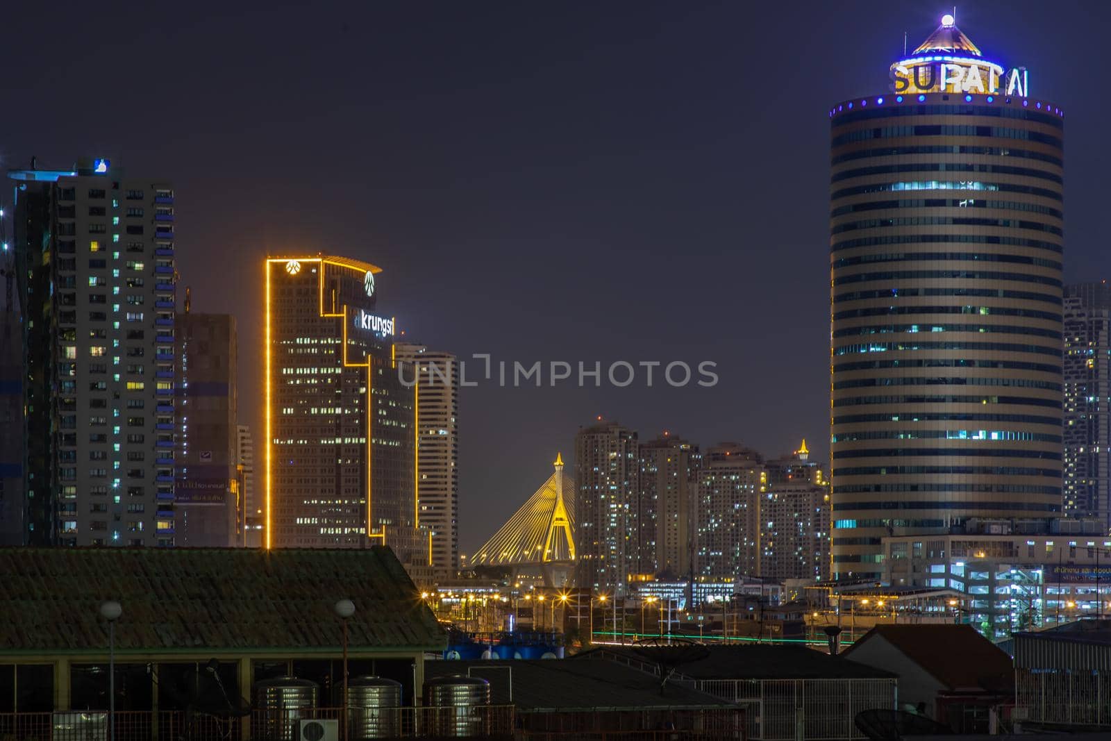 Bangkok, Thailand - 05 Apr 2020 : Bangkok downtown at night view in the business district, Beautiful twilight give the city a modern style, Selective focus.