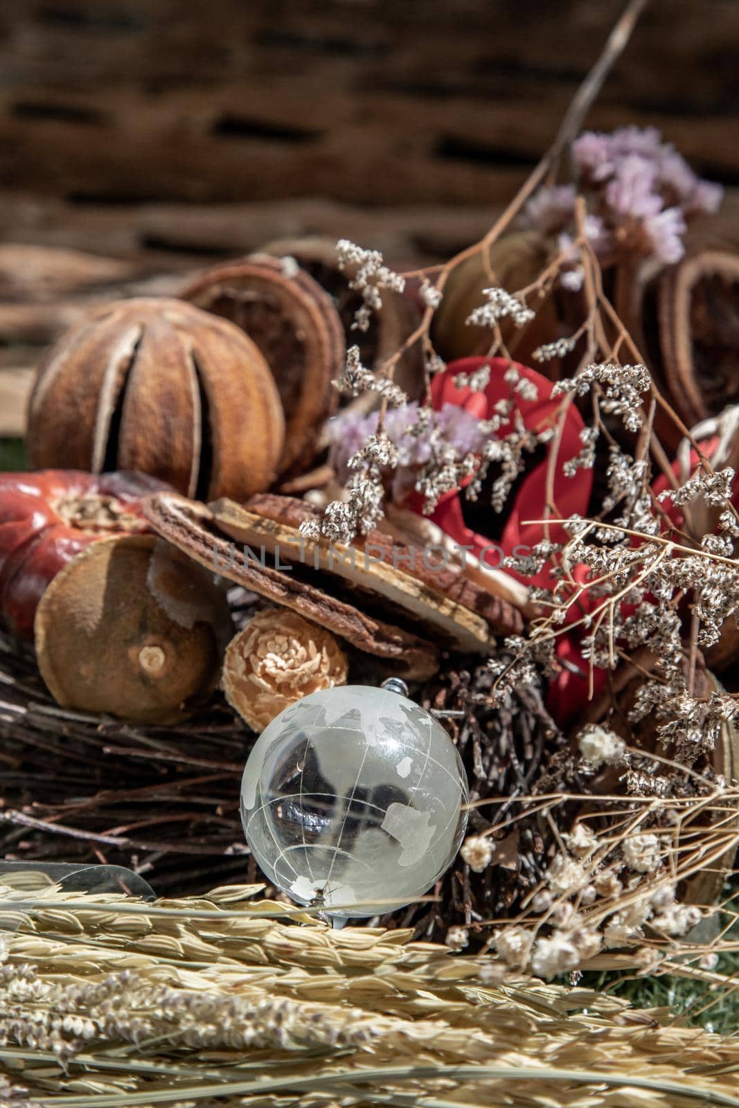 The freshness of Glass crystal globe in the middle of dried flowers. World Environment and Ecology concept, nature background.