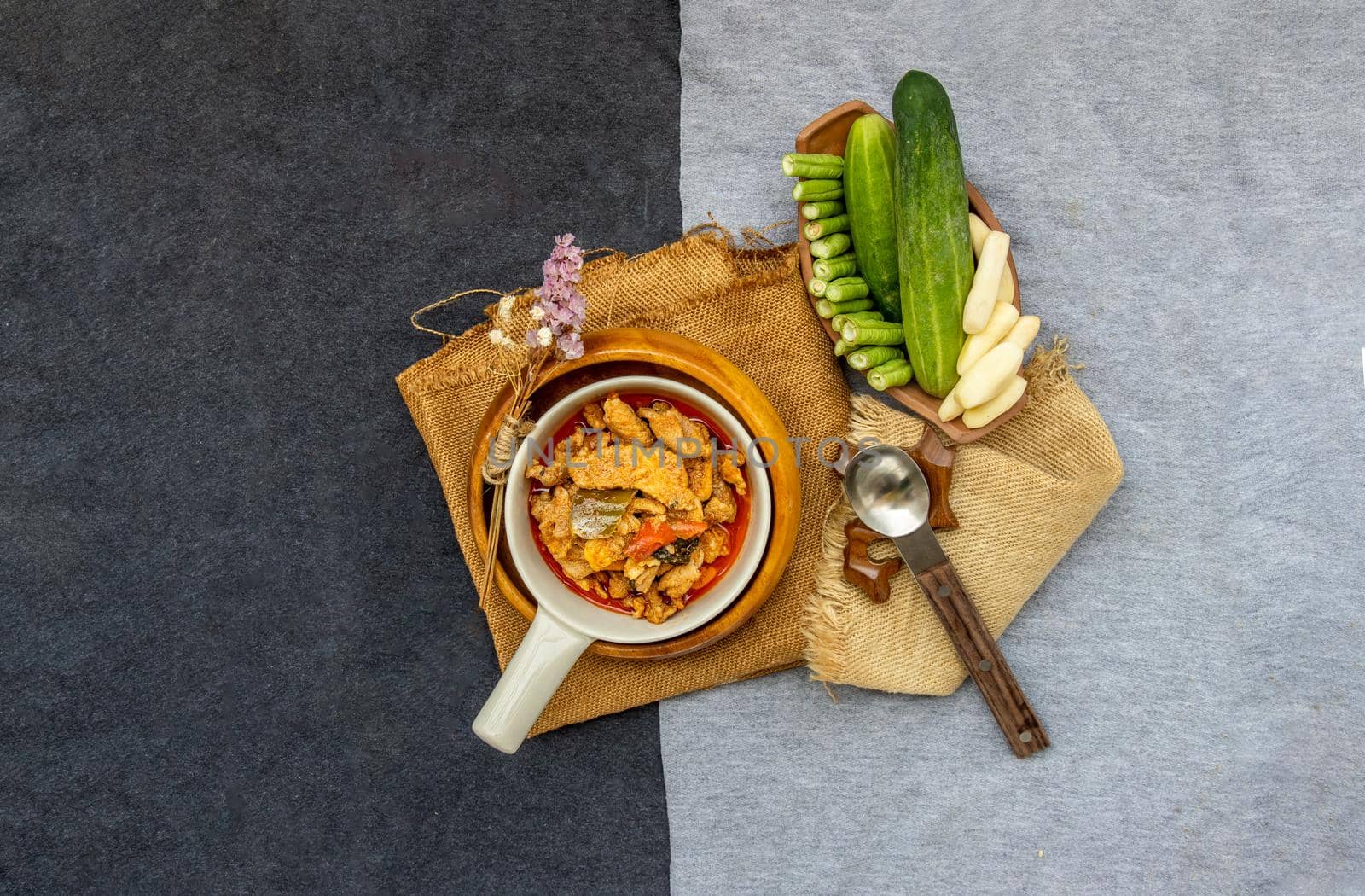 Thai style food : Panaeng Curry with Pork menu with Coconut milk (Dried red pork coconut curry) Served with vegetable. Delicious and famous Thailand food. Top view.
