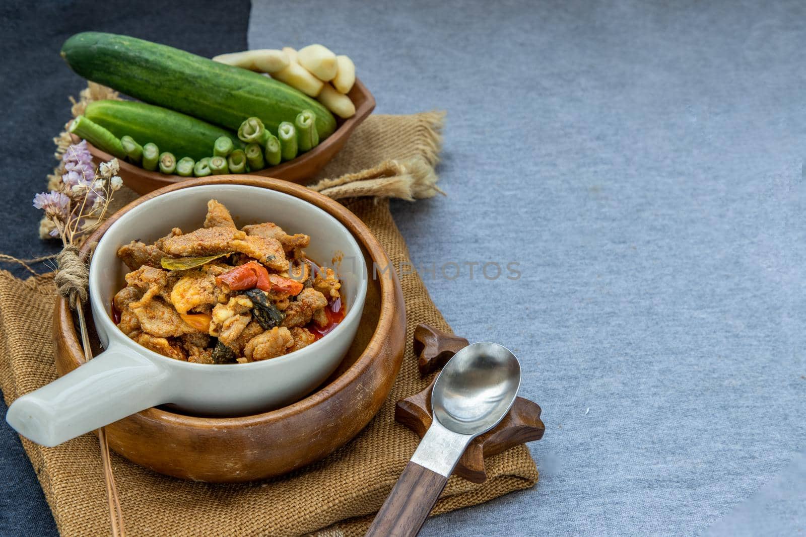 Thai style food : Panaeng Curry with Pork menu with Coconut milk (Dried red pork coconut curry) Served with vegetable. Delicious and famous Thailand food.