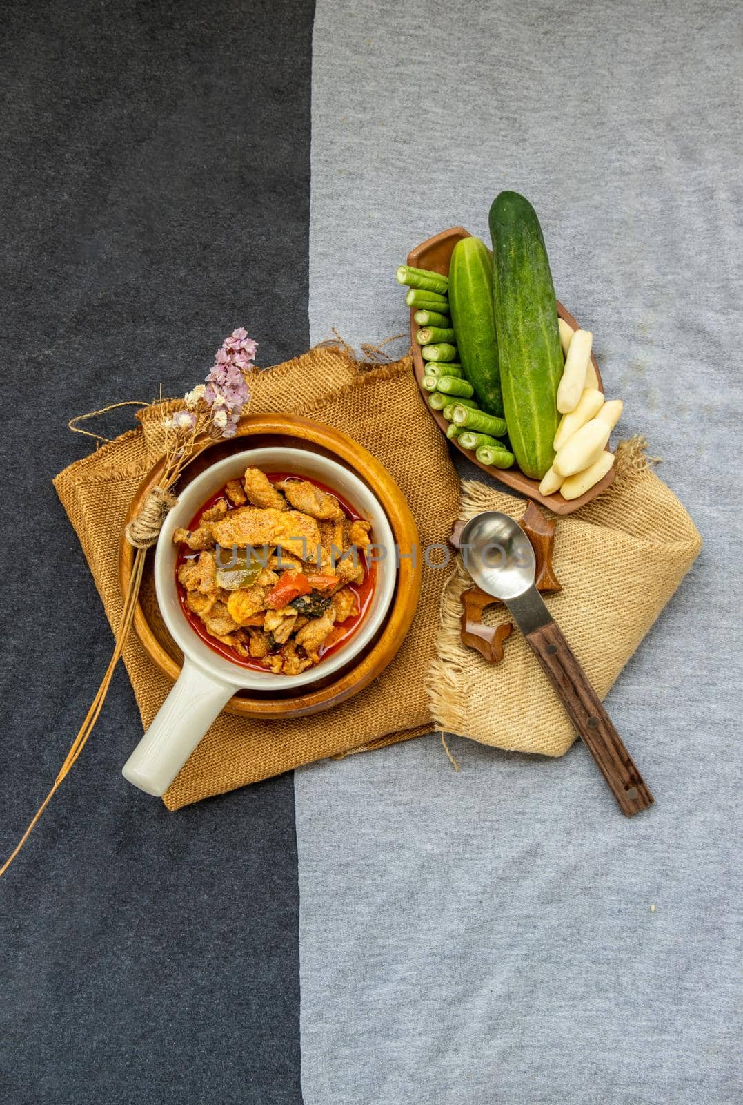 Thai style food : Panaeng Curry with Pork menu with Coconut milk (Dried red pork coconut curry) Served with vegetable. Delicious and famous Thailand food. Top view.