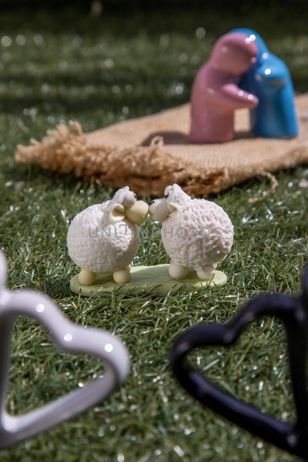 Ceramic couple dolls hug and Sheep ceramic couple dolls Kissing on lawn. Concept for anniversary, Wedding and eternal love concept, Romance wedding or Valentine’s day.