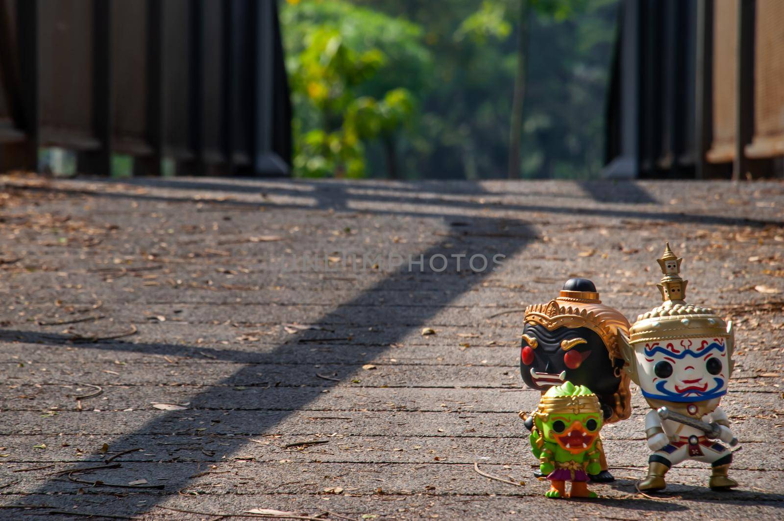 Bangkok, Thailand - Nov 18, 2019 : Ravana, Giantess and Hanuman Walking on the bridge in the park. Traveller doll. No focus, specifically.