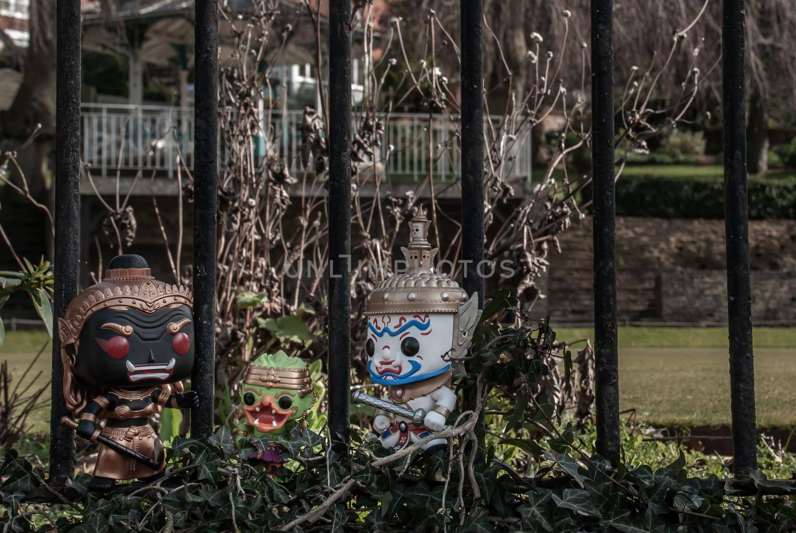 Ravana, Giantess and Hanuman Standing on the wall of the iron fence in the park. Traveller doll.