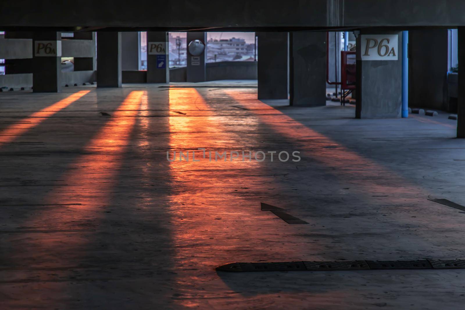 Empty car parking interior at evening. Parking garage lot, No focus, specifically.
