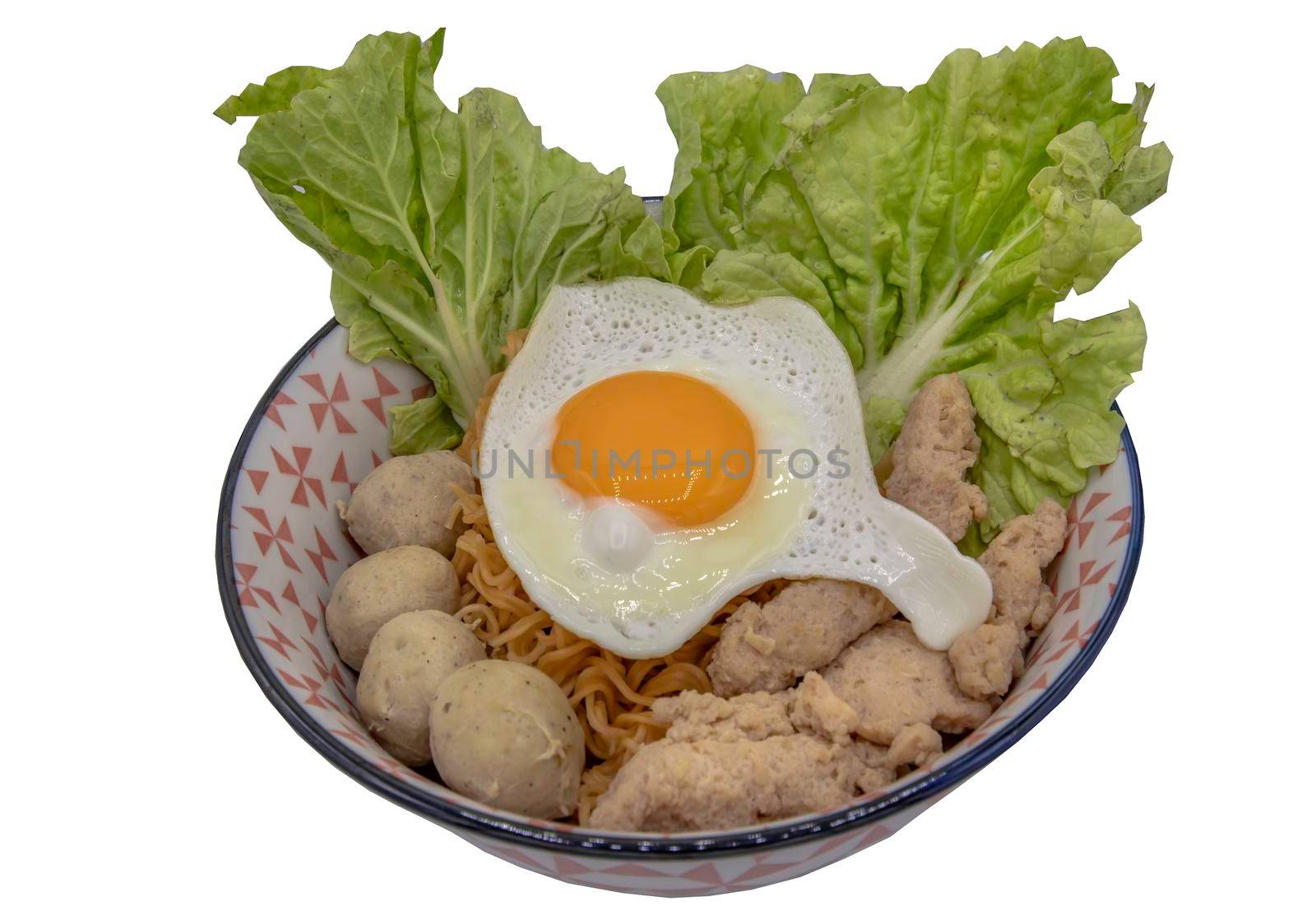 Boil egg noodles with pork ball, minced pork, fried egg and vegetables isolated on white background with clipping path. Selective focus.