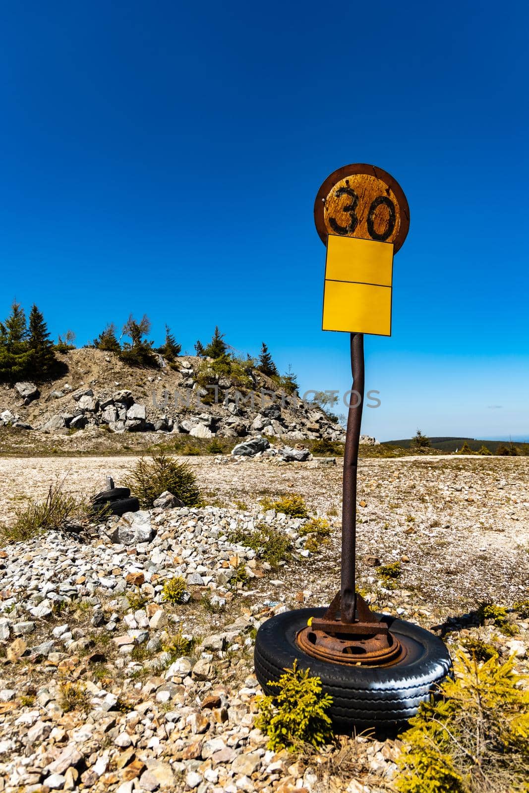 Old rusty 30 speed limit sign on steel pipe in old quartz mine Stanislaw by Wierzchu