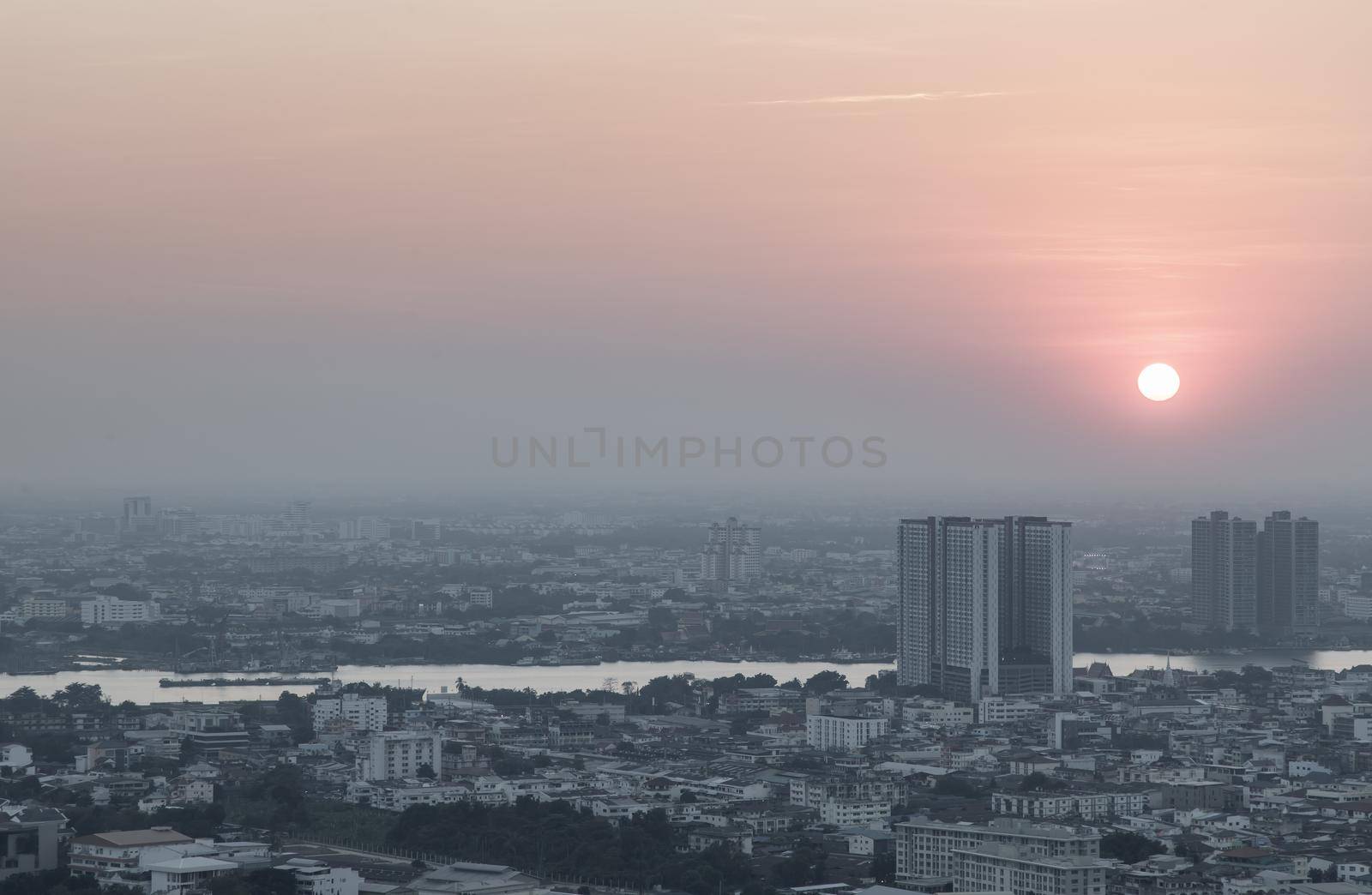 Bangkok, Thailand - Jan 12, 2021 : Aerial view of Amazing beautiful scenery view of Bangkok City skyline and skyscraper before sun setting creates relaxing feeling for the rest of the day. Evening time, Selective focus.