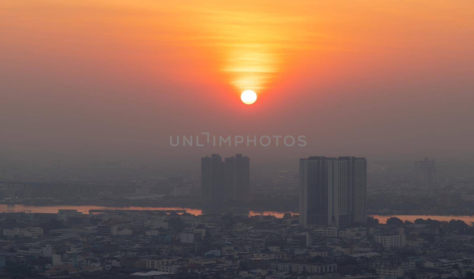 Bangkok, Thailand - Jan 13, 2021 : Aerial view of Amazing beautiful scenery view of Bangkok City skyline and skyscraper before sun setting creates relaxing feeling for the rest of the day. Evening time, Selective focus.