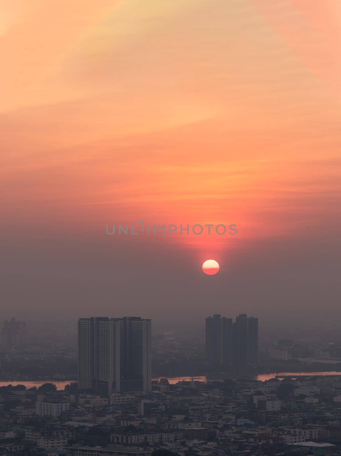 Bangkok, Thailand - Jan 13, 2021 : Aerial view of Amazing beautiful scenery view of Bangkok City skyline and skyscraper before sun setting creates relaxing feeling for the rest of the day. Evening time, Selective focus.