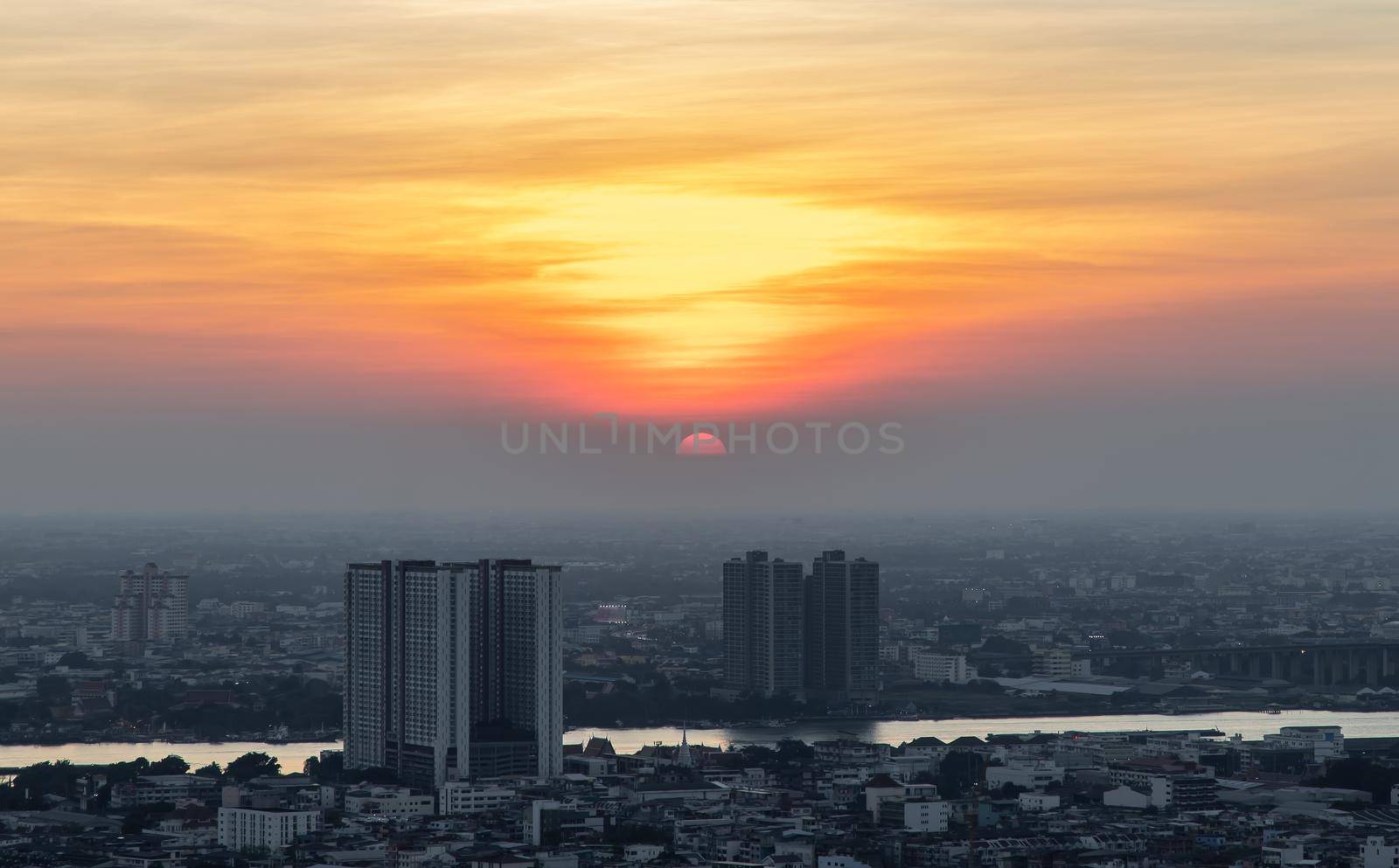 Bangkok, Thailand - Jan 10, 2021 : Aerial view of Amazing beautiful scenery view of Bangkok City skyline and skyscraper before sun setting creates relaxing feeling for the rest of the day. Evening time, Selective focus.