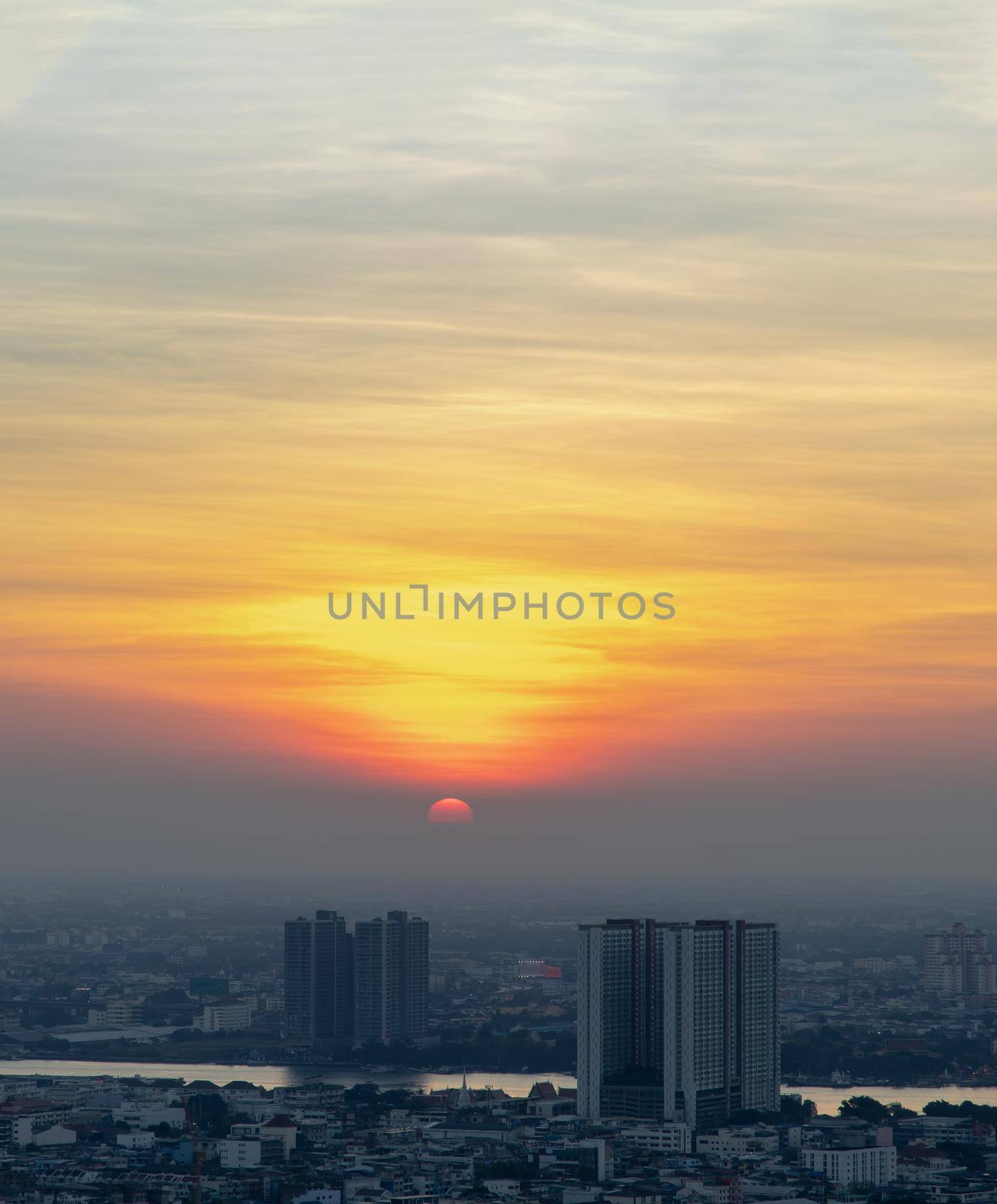 Bangkok, Thailand - Jan 10, 2021 : Aerial view of Amazing beautiful scenery view of Bangkok City skyline and skyscraper before sun setting creates relaxing feeling for the rest of the day. Evening time, Selective focus.