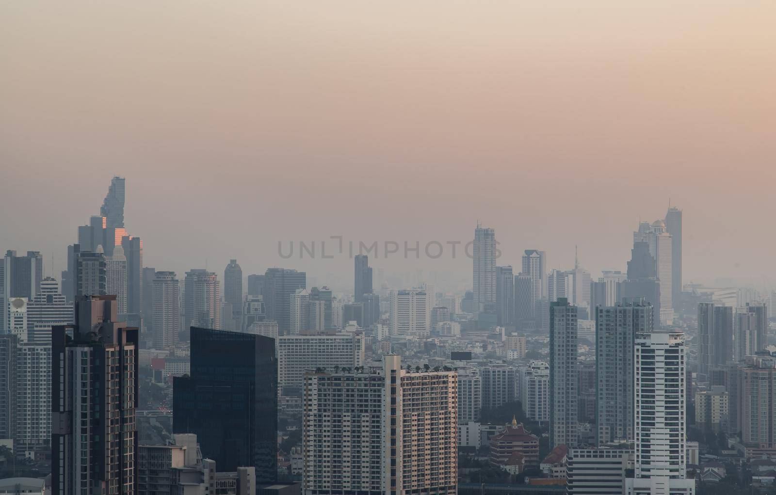 Bangkok, Thailand - Jan 13, 2021 : Aerial view of Beautiful scenery view of Skyscraper Evening time before Sunset creates relaxing feeling for the rest of the day. Selective focus.