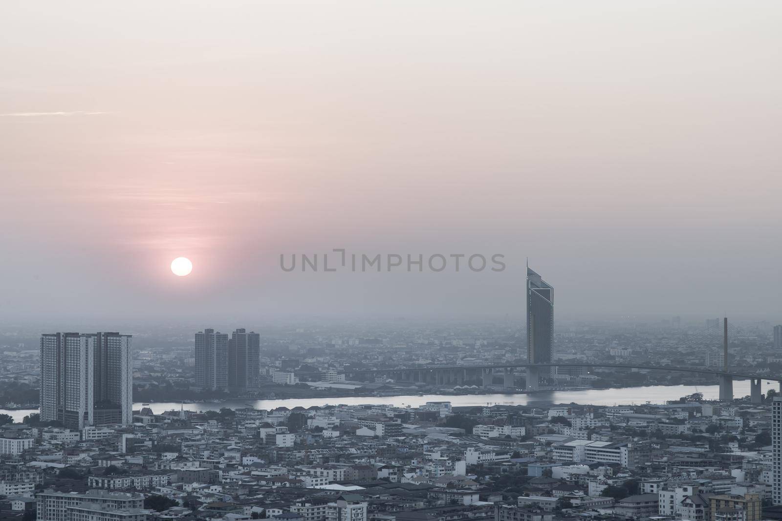 Bangkok, Thailand - Jan 12, 2021 : Aerial view of Amazing beautiful scenery view of Bangkok City skyline and skyscraper before sun setting creates relaxing feeling for the rest of the day. Evening time, Selective focus.