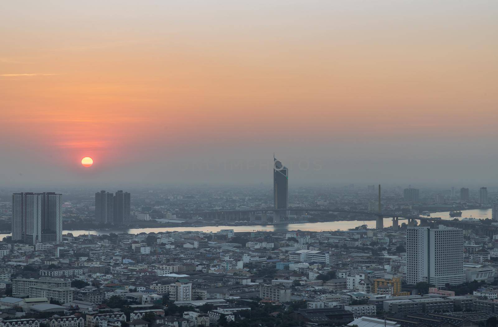 Bangkok, Thailand - Jan 12, 2021 : Aerial view of Amazing beautiful scenery view of Bangkok City skyline and skyscraper before sun setting creates relaxing feeling for the rest of the day. Evening time, Selective focus.