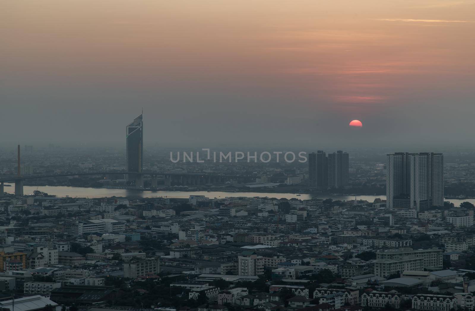 Bangkok, Thailand - Jan 12, 2021 : Aerial view of Amazing beautiful scenery view of Bangkok City skyline and skyscraper before sun setting creates relaxing feeling for the rest of the day. Evening time, Selective focus.