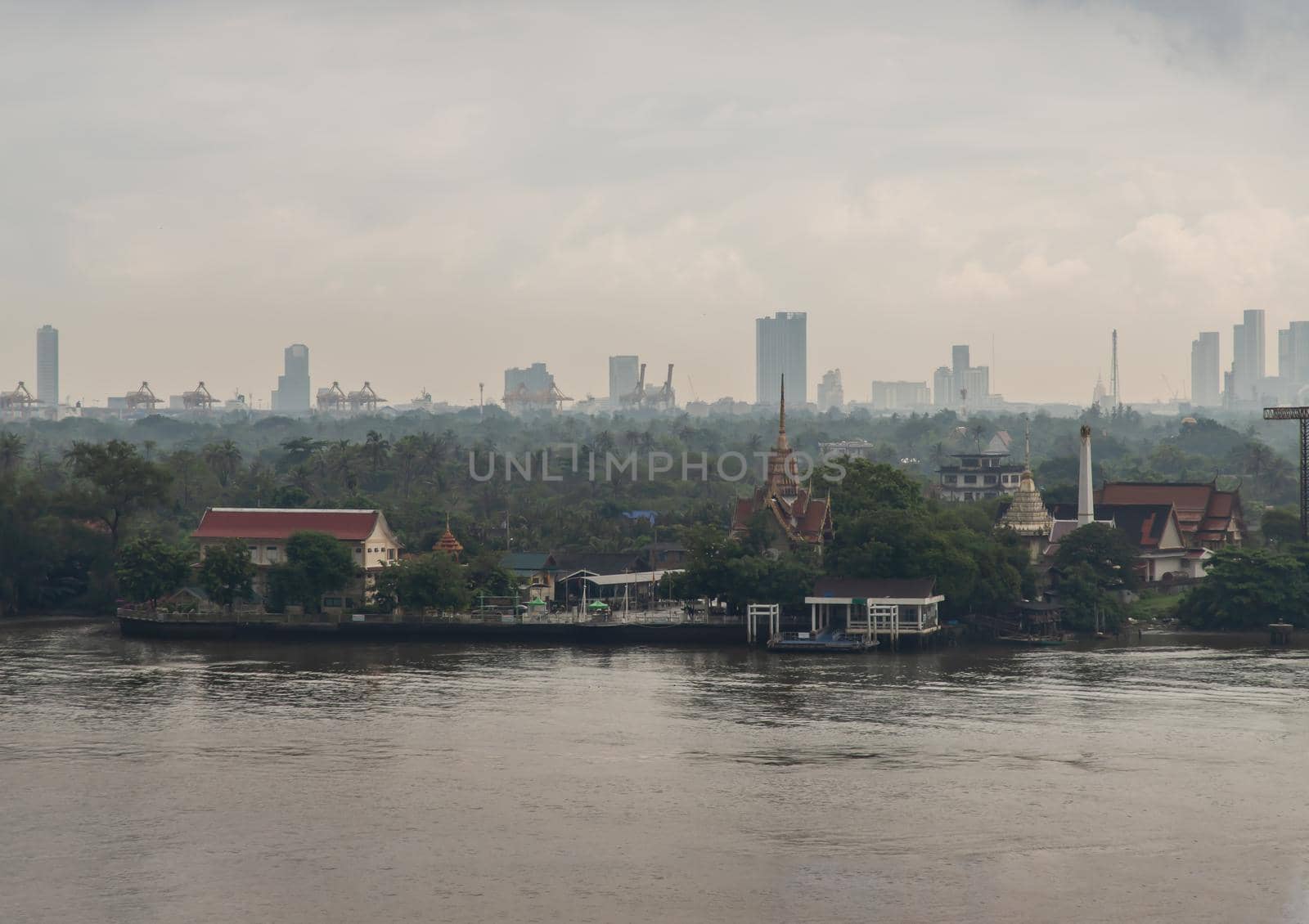 Aerial view Overlooking green area of Bang kachao lung and Bang Krachao Nok Temple Pier with a Chao Phraya River front. Focus and blur.