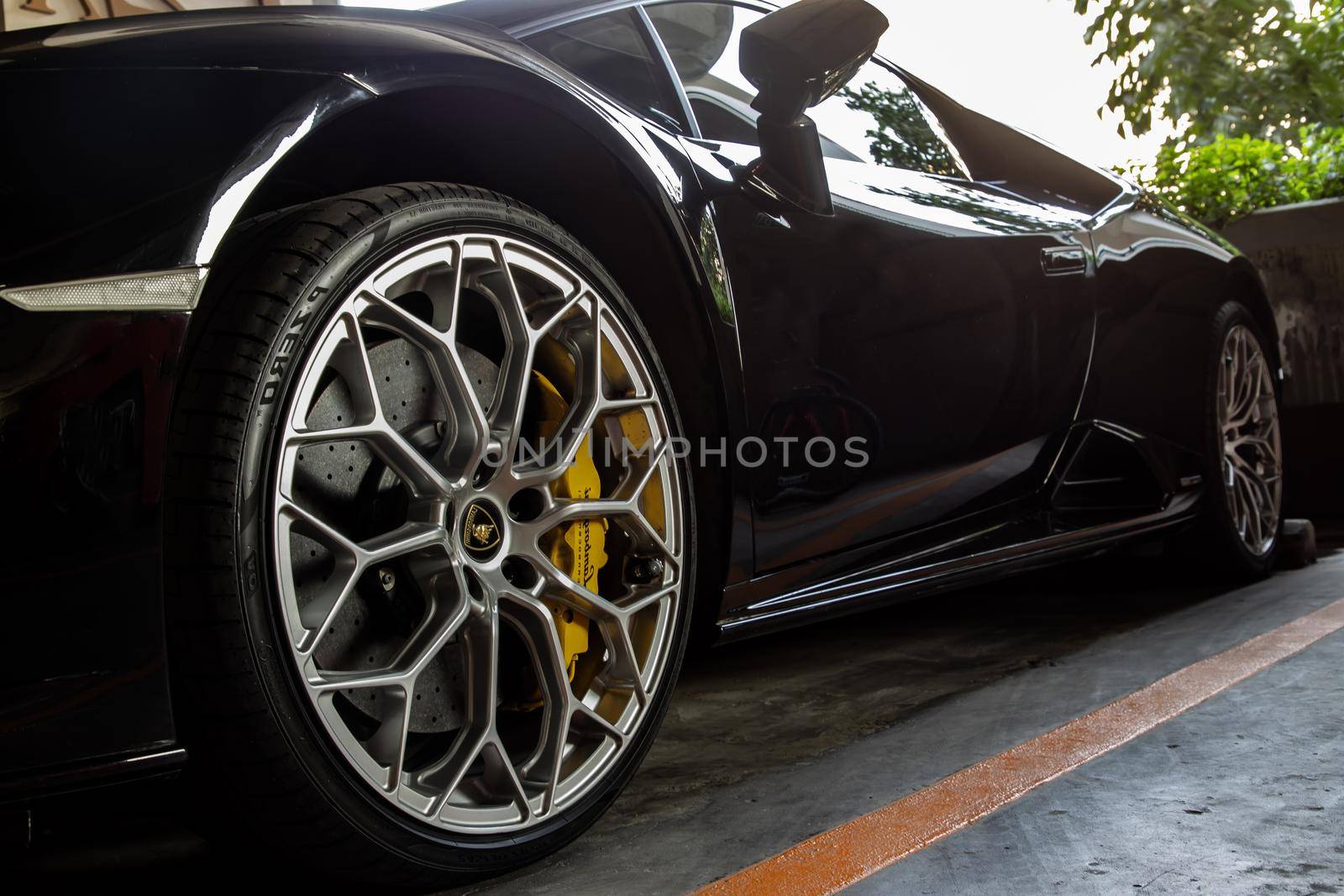 Bangkok, Thailand - 06 Jan 2021 : Close-up of Wheel of Black Lamborghini Sports Car. Lamborghini is Italian sports car. No focus, specifically.