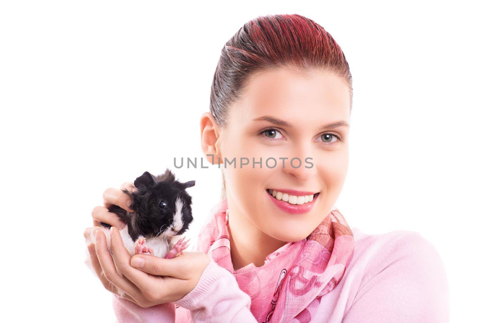 A close up portrait of a beautiful young woman with her guinea pig pet, isolated on white background. Household pets concept.